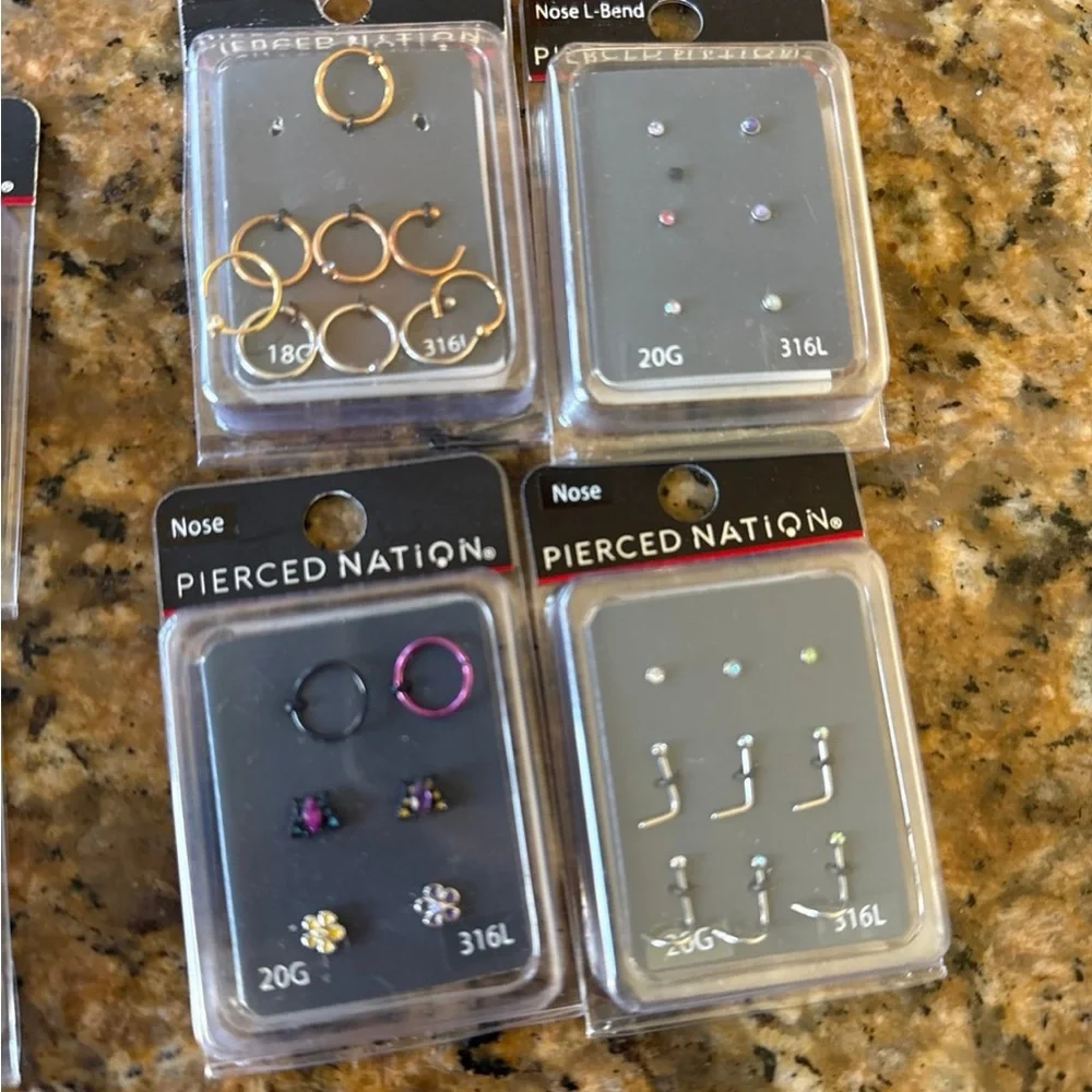 Pierced Nation nose hoops and studs in different sizes, colors, and styles.